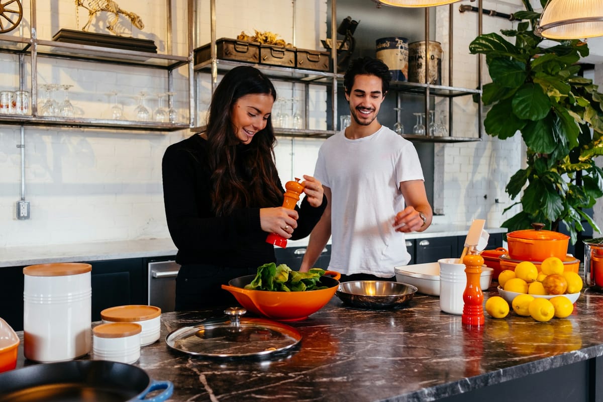 Man and woman cooking a healthy meal together
